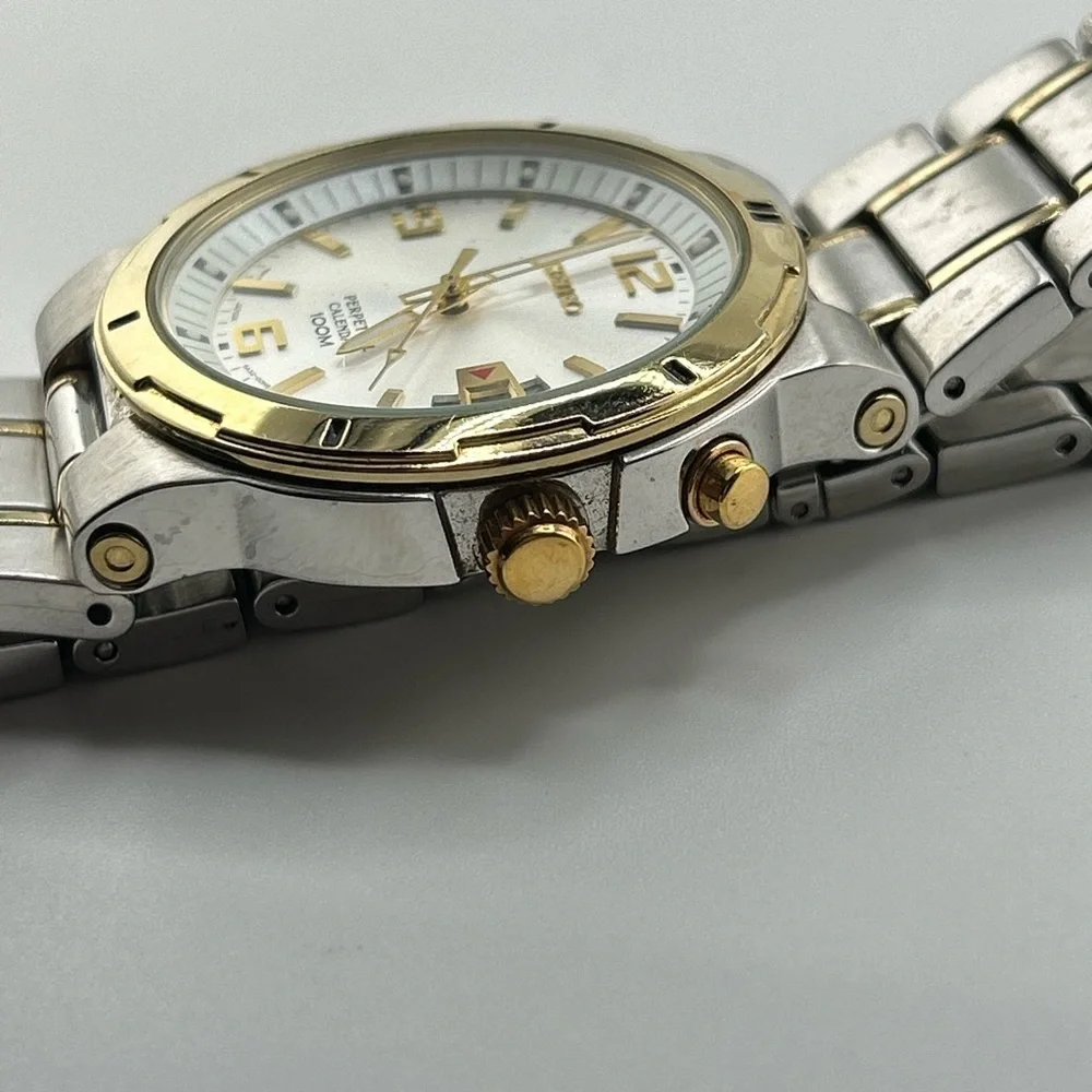 Seiko Men's SNQ076 Perpetual Calendar Two-Tone Watch #555